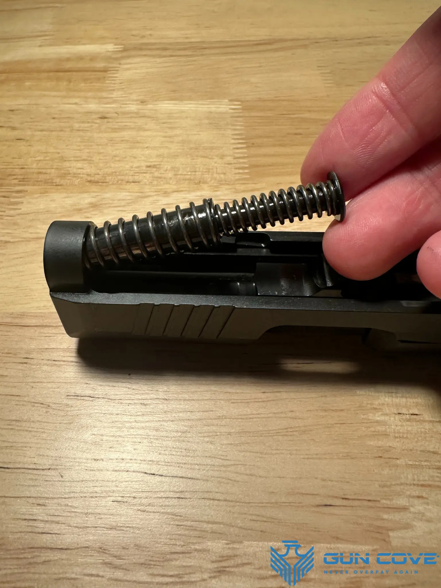 Removing the recoil spring assembly